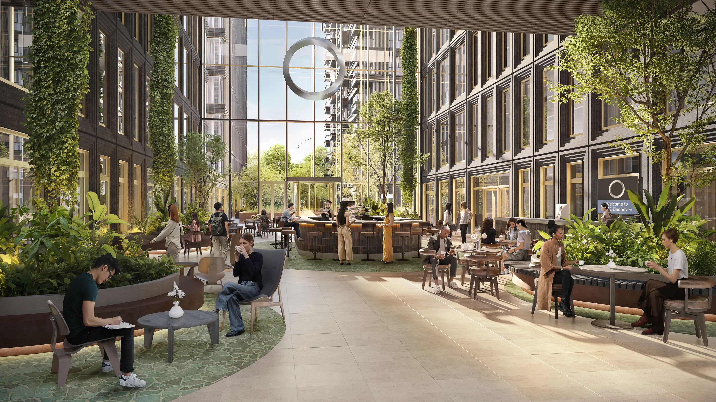 Impression of the EDGE Eindhoven atrium, with greenery, a coffee bar and seating