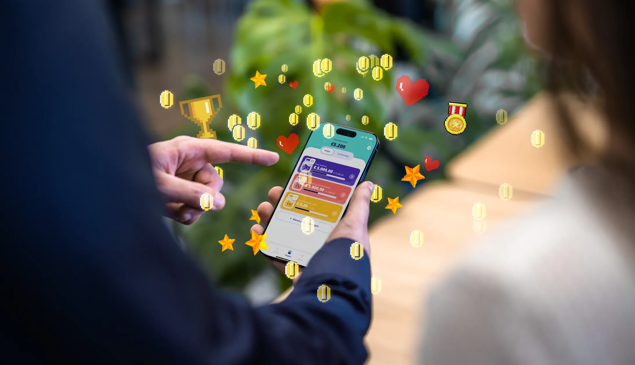 Image of a mobile app with game elements flying around it.